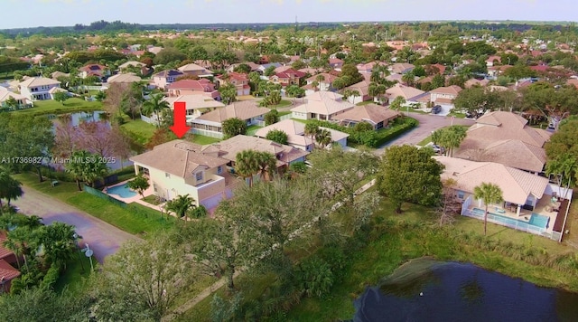 birds eye view of property featuring a water view