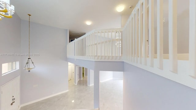 staircase featuring a high ceiling