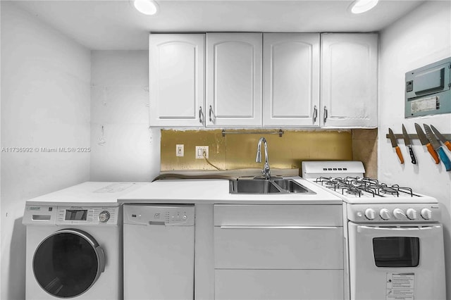 laundry area featuring washer / clothes dryer and sink