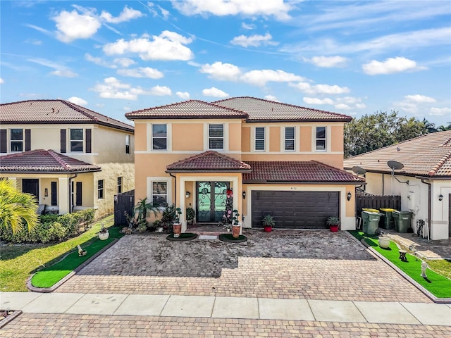 mediterranean / spanish-style house featuring a garage