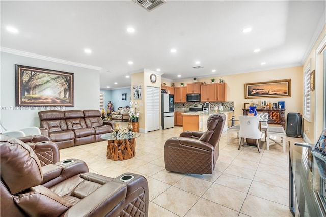 tiled living room featuring sink and crown molding