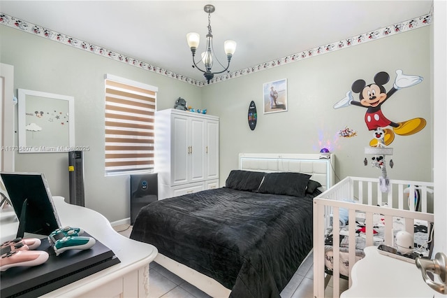 tiled bedroom featuring a chandelier