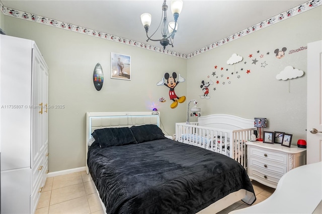 bedroom with light tile patterned flooring and a notable chandelier