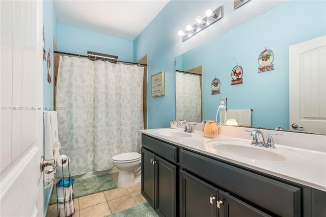 bathroom featuring vanity, curtained shower, tile patterned floors, and toilet