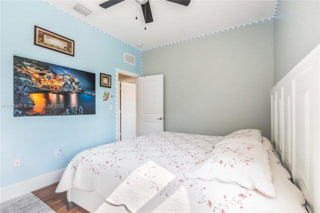 bedroom featuring ceiling fan and hardwood / wood-style floors