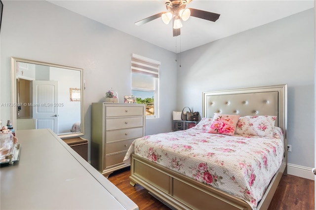 bedroom featuring ceiling fan and dark hardwood / wood-style flooring