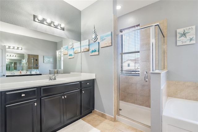 bathroom featuring vanity, tile patterned floors, and independent shower and bath