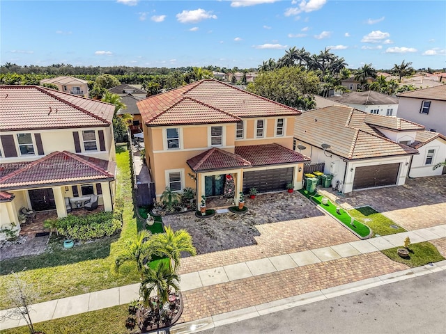 mediterranean / spanish-style home with a garage