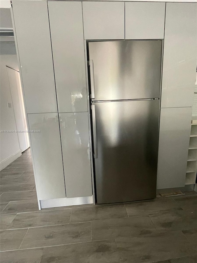 interior space featuring stainless steel refrigerator