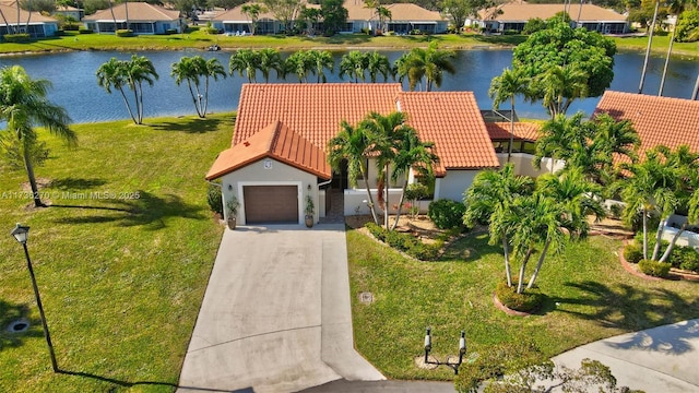 drone / aerial view with a water view