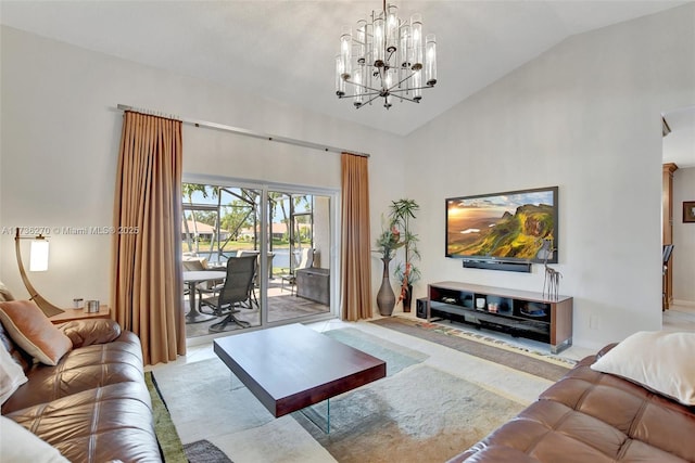 living room with an inviting chandelier and high vaulted ceiling