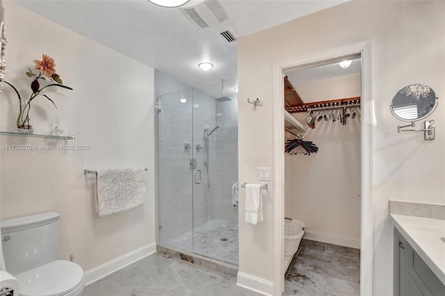 bathroom with vanity, toilet, and walk in shower