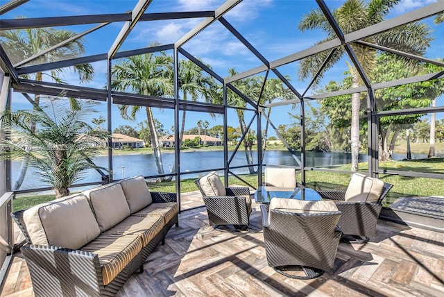 view of patio / terrace featuring a water view, an outdoor hangout area, and a lanai