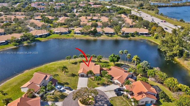 birds eye view of property featuring a water view