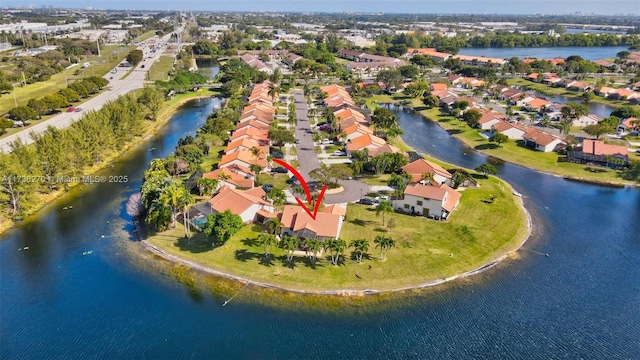 bird's eye view with a water view