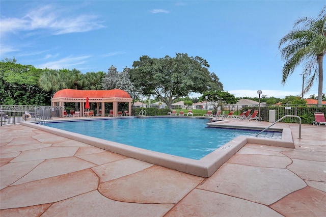 view of swimming pool with a patio area