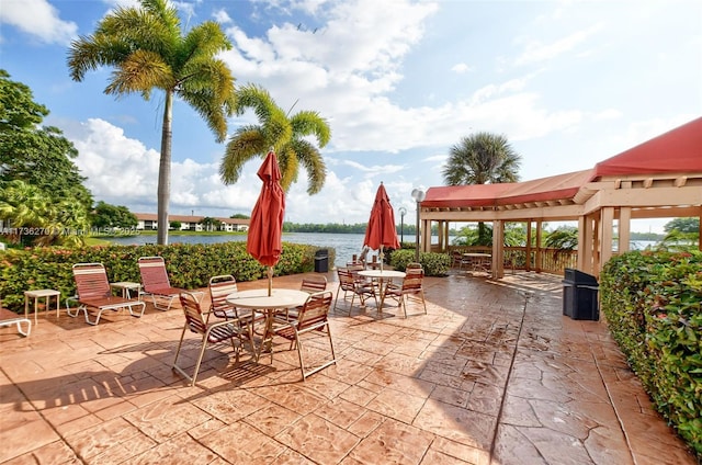 view of patio / terrace with a gazebo and a water view