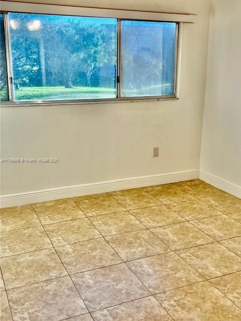 view of tiled spare room