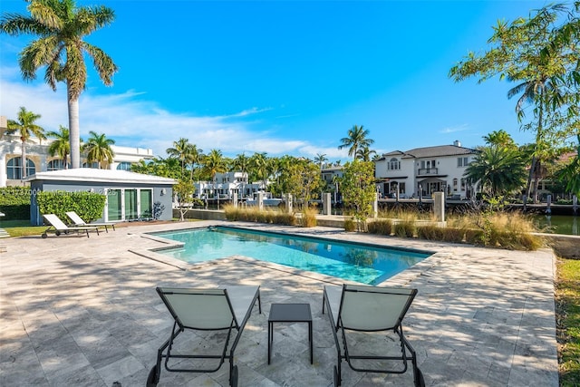 view of swimming pool with a patio area