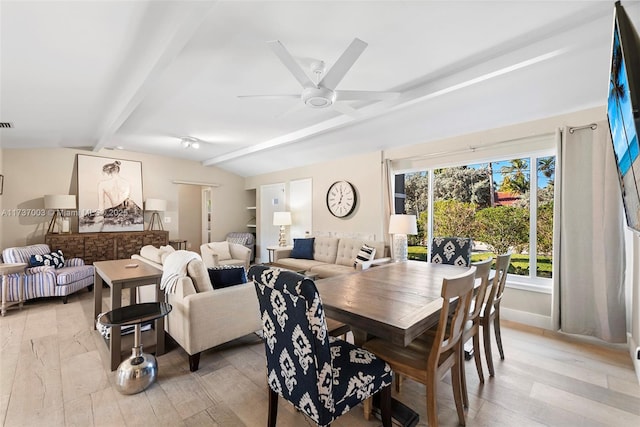 dining area featuring lofted ceiling with beams, ceiling fan, and light wood-type flooring