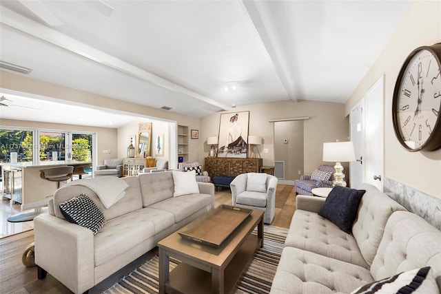 living room featuring built in features, wood-type flooring, and lofted ceiling with beams