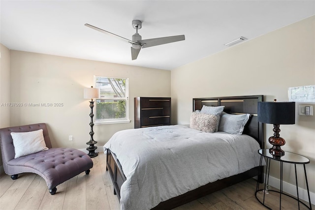 bedroom with ceiling fan and light wood-type flooring