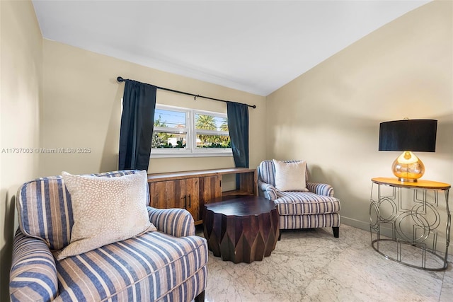 sitting room with vaulted ceiling