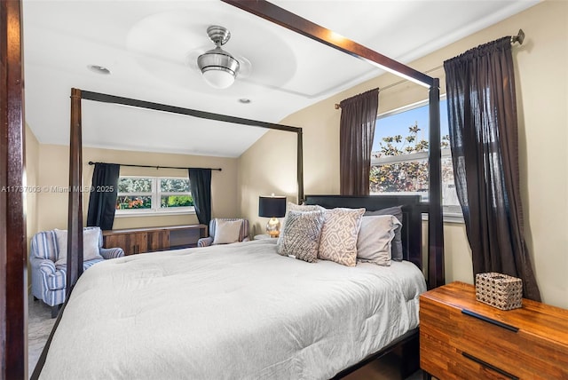 bedroom with vaulted ceiling with beams