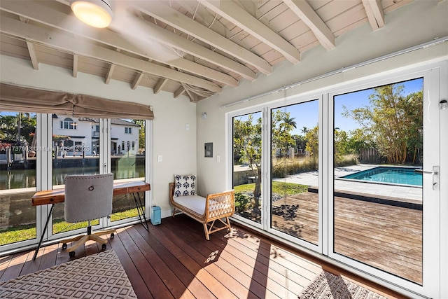 sunroom / solarium featuring beamed ceiling, a water view, and wooden ceiling