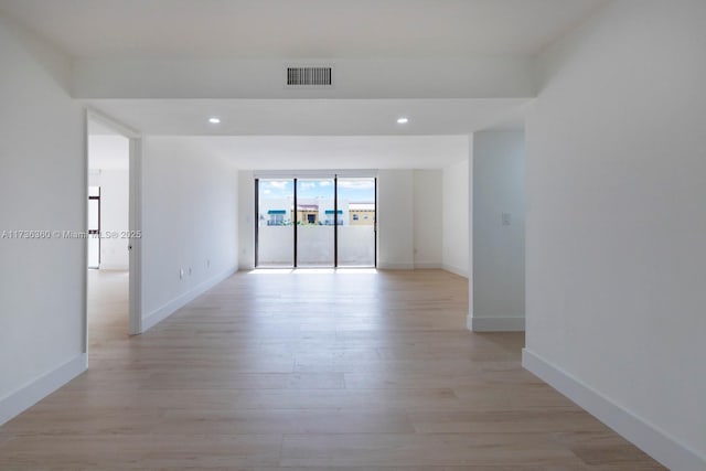 unfurnished room featuring light hardwood / wood-style flooring