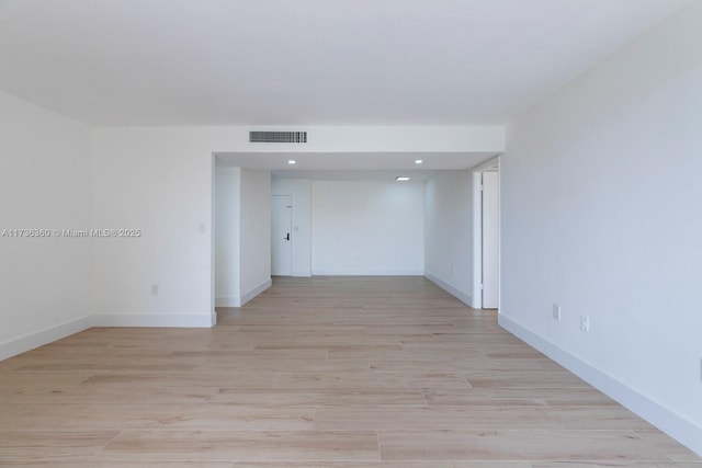 spare room featuring light hardwood / wood-style floors