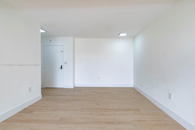 spare room featuring light hardwood / wood-style floors