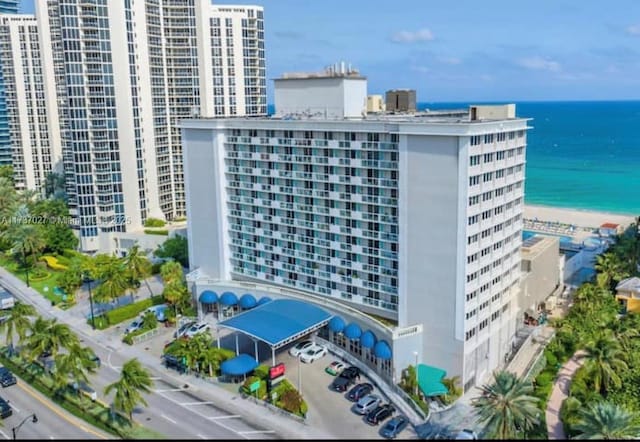 view of property featuring a water view and a view of the beach