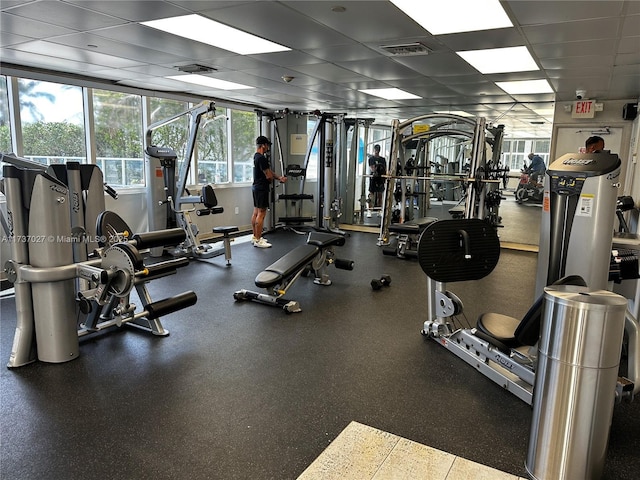 gym featuring a drop ceiling