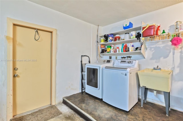 clothes washing area featuring washing machine and clothes dryer