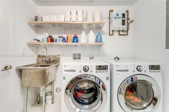 laundry area featuring sink and washing machine and dryer