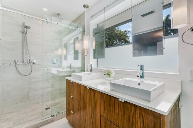 bathroom with vanity and an enclosed shower