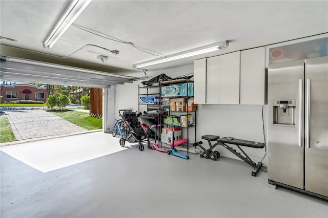 garage featuring stainless steel fridge