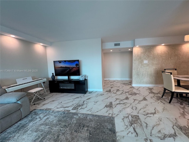 living area featuring marble finish floor, baseboards, visible vents, and recessed lighting