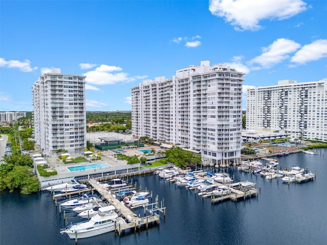 drone / aerial view featuring a water view and a city view