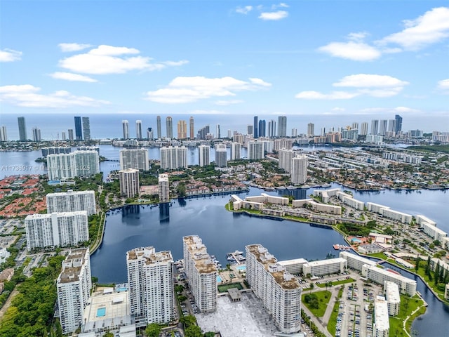 drone / aerial view featuring a water view and a city view