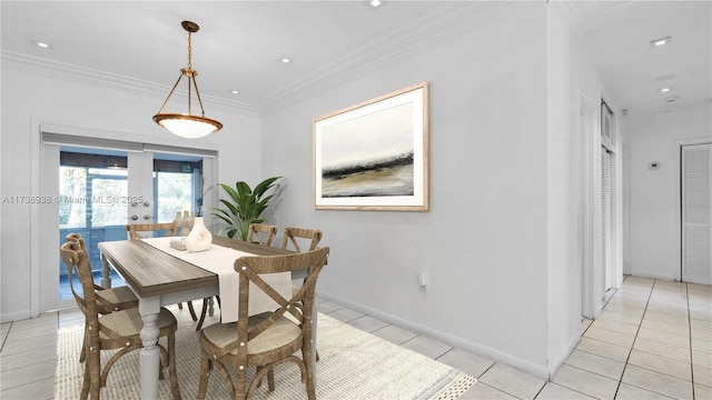 dining room featuring light tile patterned floors, french doors, baseboards, and ornamental molding