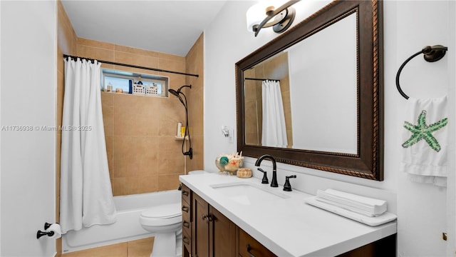 full bathroom featuring tile patterned flooring, toilet, vanity, and shower / tub combo with curtain