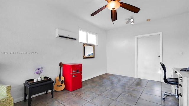 office space with a wall unit AC and a ceiling fan