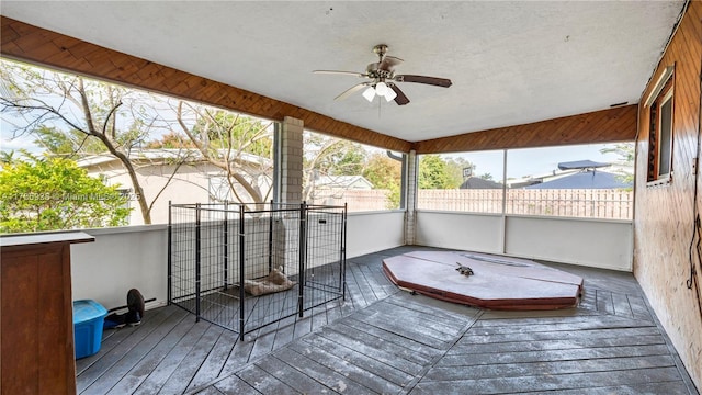 deck with ceiling fan and fence