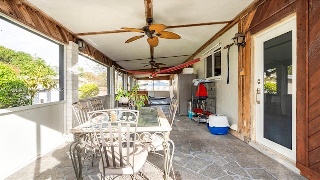 sunroom / solarium with ceiling fan