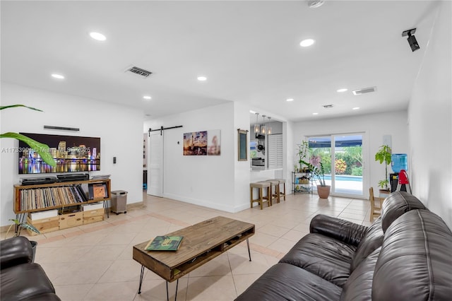 tiled living room featuring a barn door