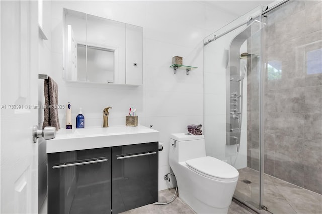 bathroom featuring walk in shower, vanity, toilet, and tile walls