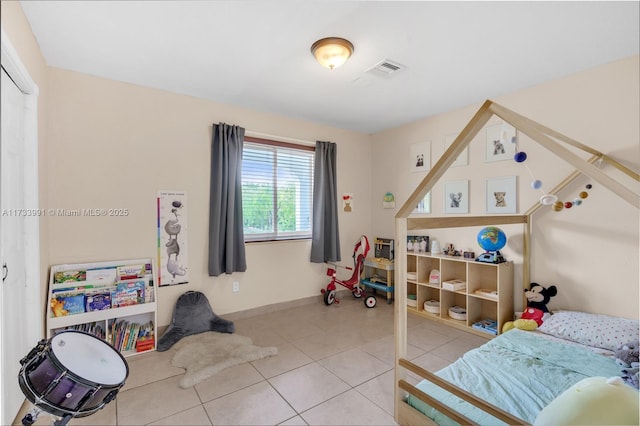 bedroom featuring light tile patterned flooring