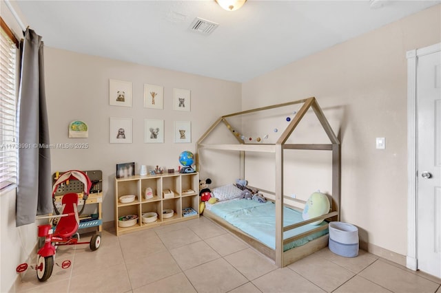 bedroom featuring tile patterned floors